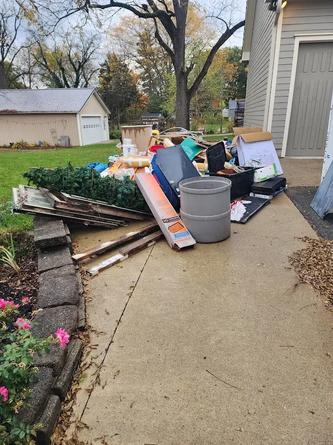 Dumpster being loaded with debris for Residential Dumpster Rental in South Bound Brook